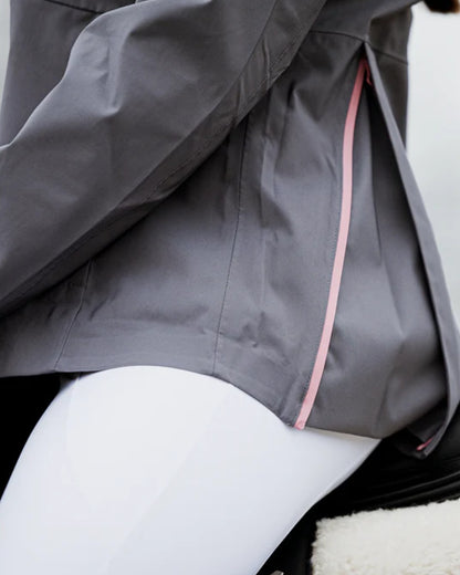 Charcoal Pink coloured Equidry Womens Varsha Jacket with Stowaway Hood on outdoor background 