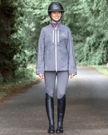 Charcoal Pink coloured Equidry Womens Varsha Jacket with Stowaway Hood on street background 