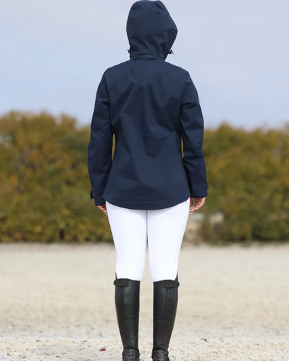 Navy coloured Equidry Womens Varsha Jacket with Stowaway Hood on sand background 