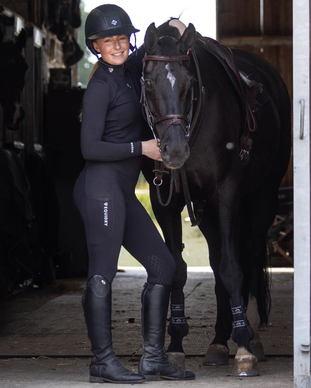 Black White Coloured Equidry Womens Water Repellent Base Layer on outdoor background 