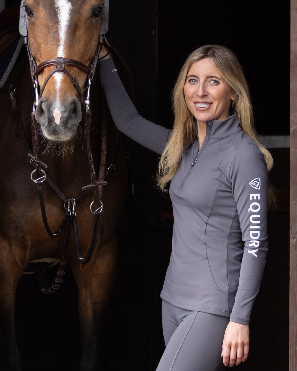 Grey White Coloured Equidry Womens Water Repellent Base Layer on stable background 