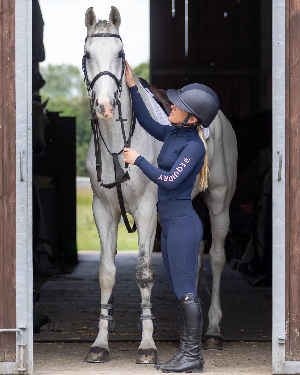 Navy Pale Pink Coloured Equidry Womens Water Repellent Base Layer on stable background 