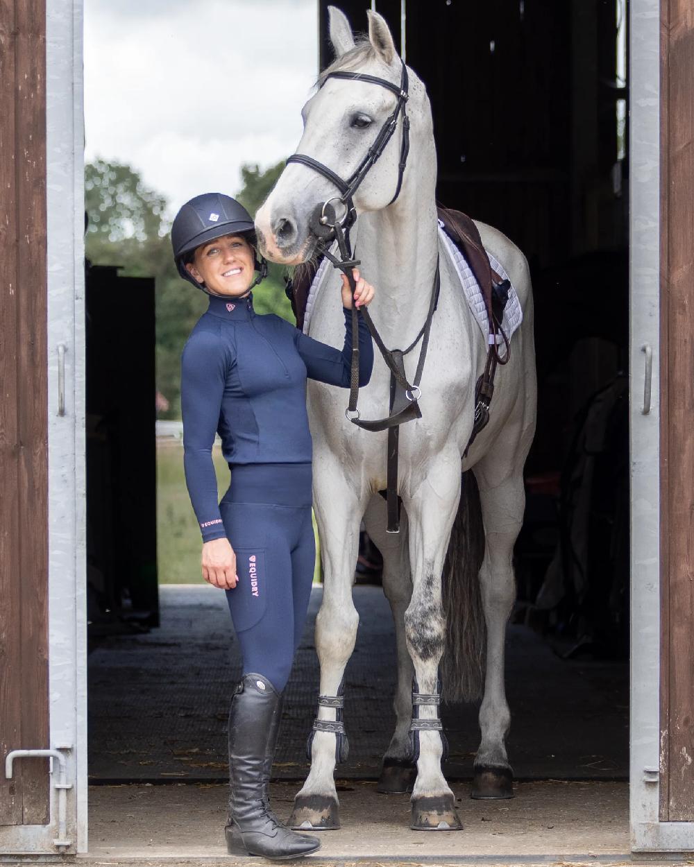 Navy Pale Pink Coloured Equidry Womens Water Repellent Base Layer on stable background 
