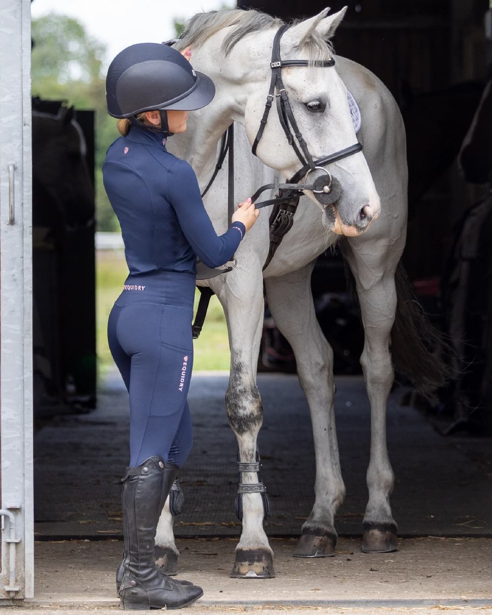 Navy Pale Pink Coloured Equidry Womens Water Repellent Base Layer on stable background 