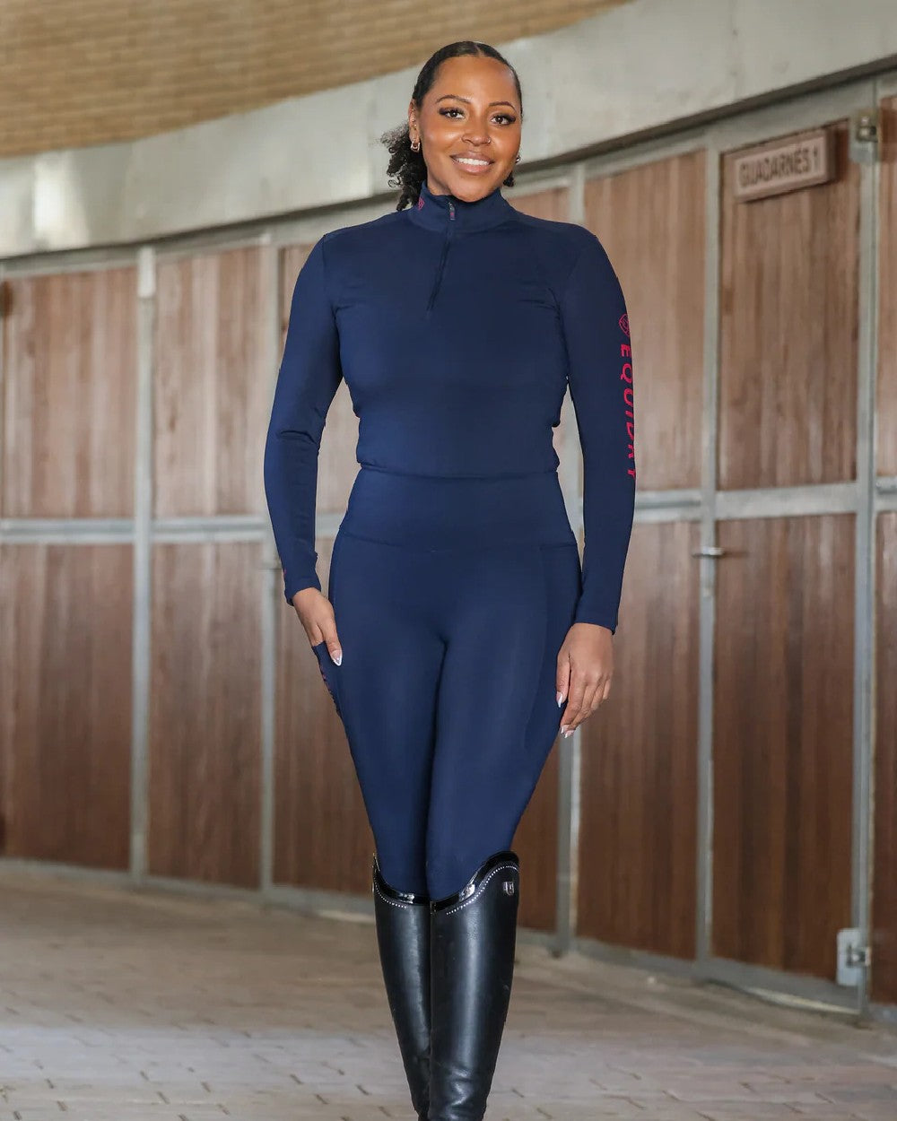 Navy Raspberry Coloured Equidry Womens Water Repellent Base Layer on outdoor background 