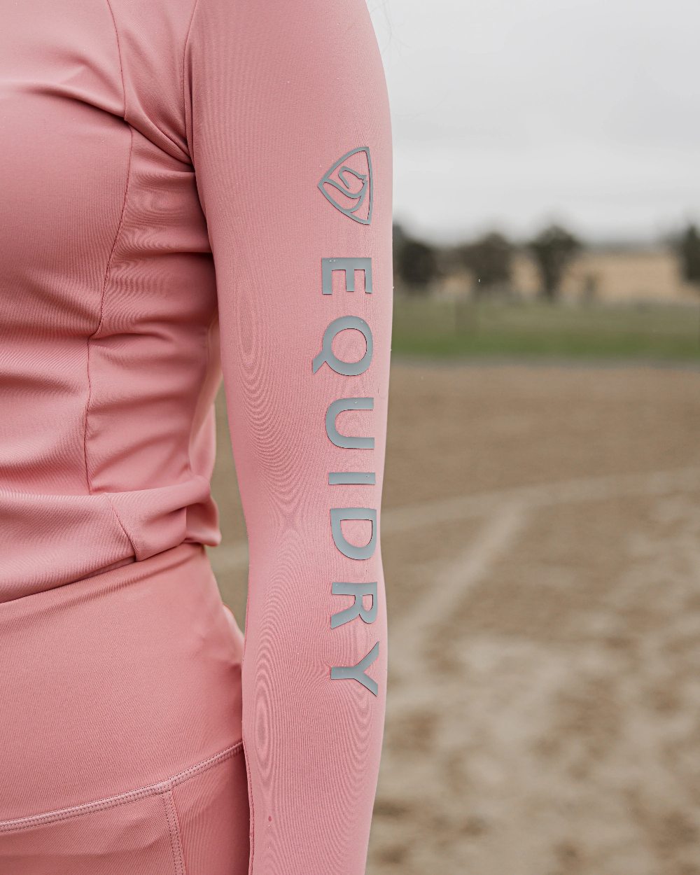 Pale Pink Grey Coloured Equidry Womens Water Repellent Base Layer on outdoor background 