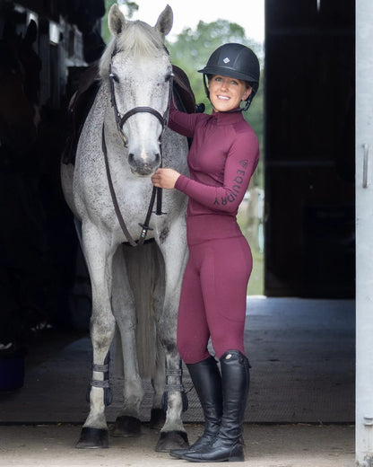 Plum Black Coloured Equidry Womens Water Repellent Base Layer on stable background 