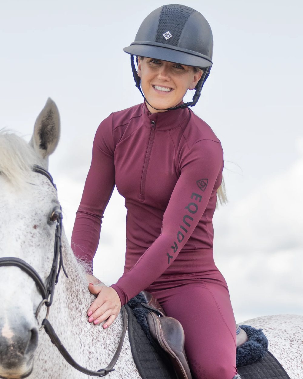 Plum Black Coloured Equidry Womens Water Repellent Base Layer on outdoor background 