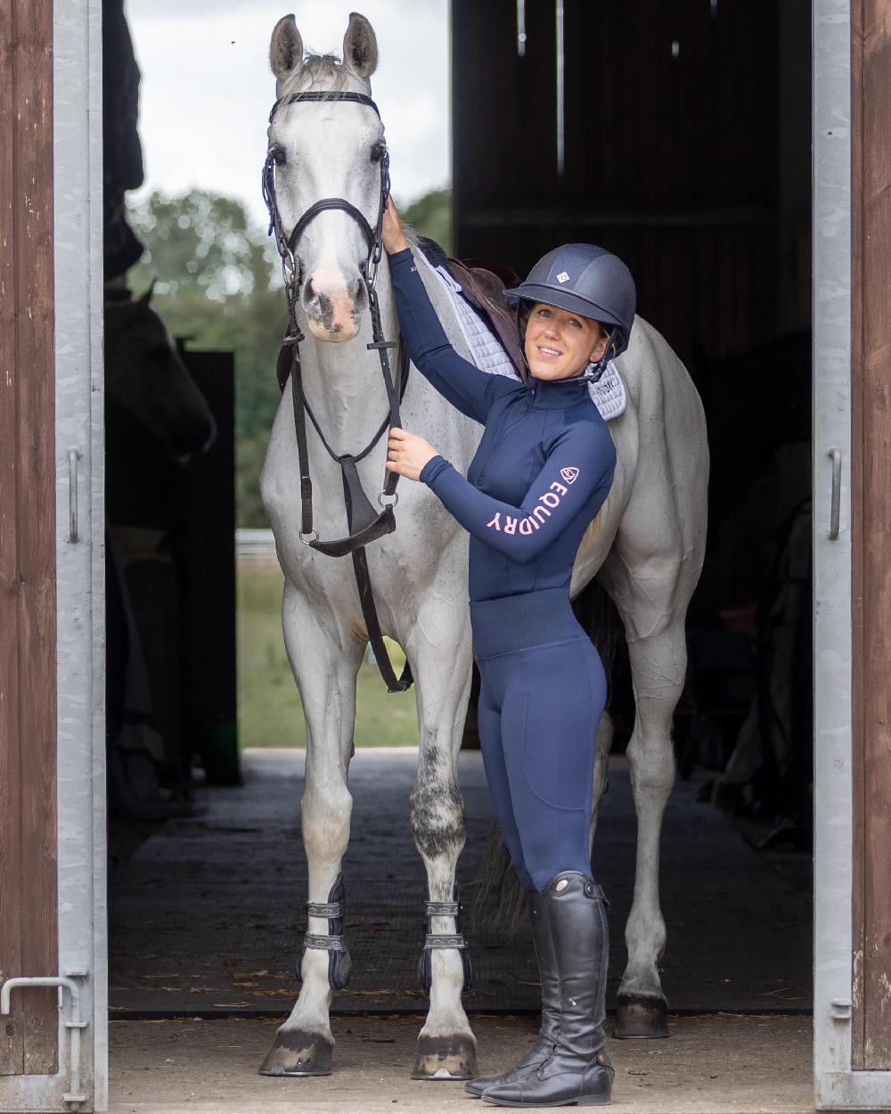 Navy Pink Coloured Equidry Womens Water Repellent Full Seat Leggings on  stable background 