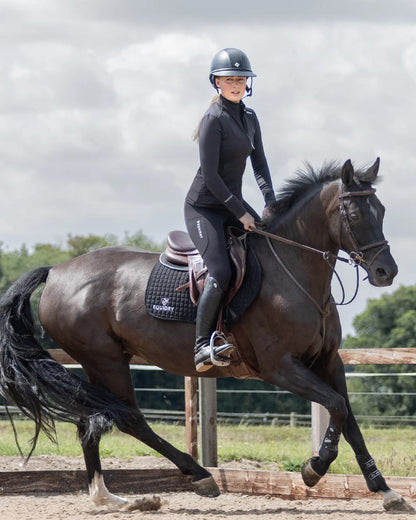 Black White Coloured Equidry Womens Water Repellent Zip Up Top on outdoor background 