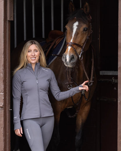 Grey White Coloured Equidry Womens Water Repellent Zip Up Top on stable background 