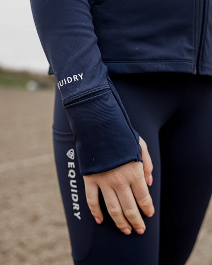 Navy White Coloured Equidry Womens Water Repellent Zip Up Top on outdoor background 