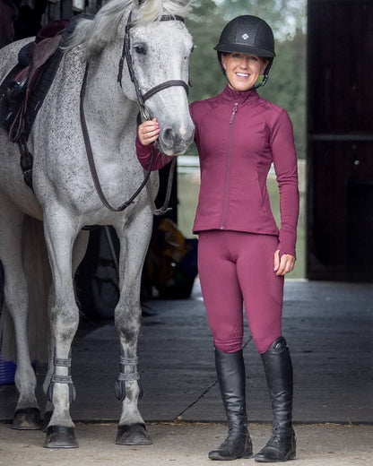 Plum Black Coloured Equidry Womens Water Repellent Zip Up Top on outdoor background 