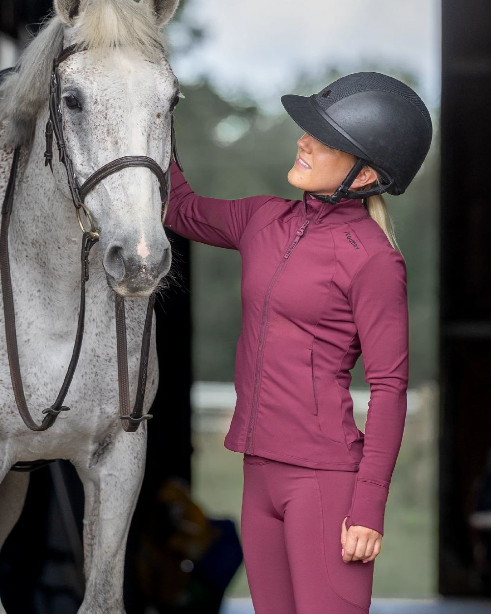 Plum Black Coloured Equidry Womens Water Repellent Zip Up Top on outdoor background 