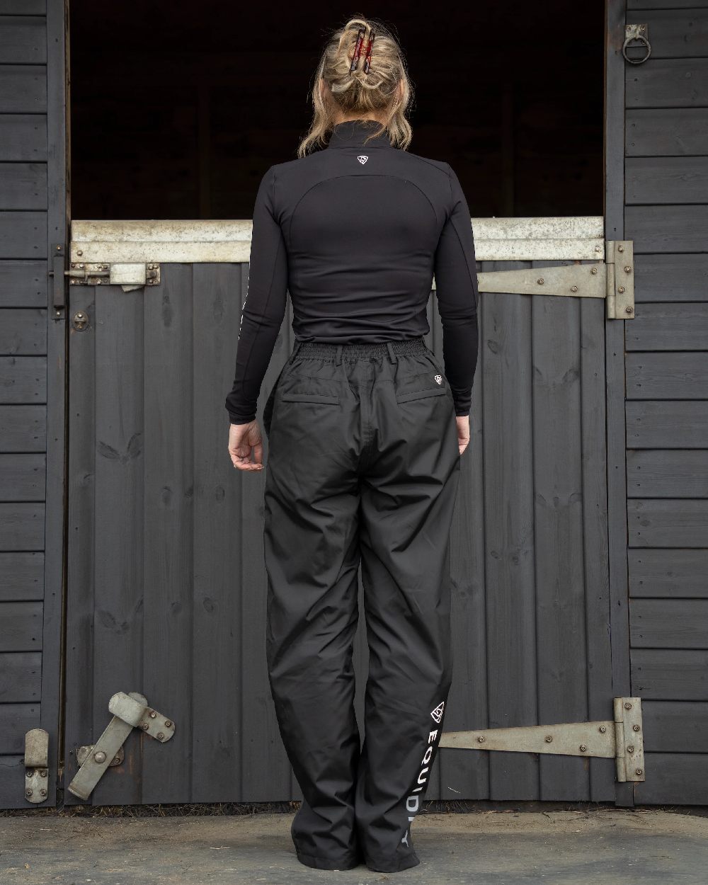 Black Coloured Equidry Womens Waterproof Fleece Lined Trousers on outdoor background 