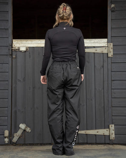 Black Coloured Equidry Womens Waterproof Fleece Lined Trousers on outdoor background 
