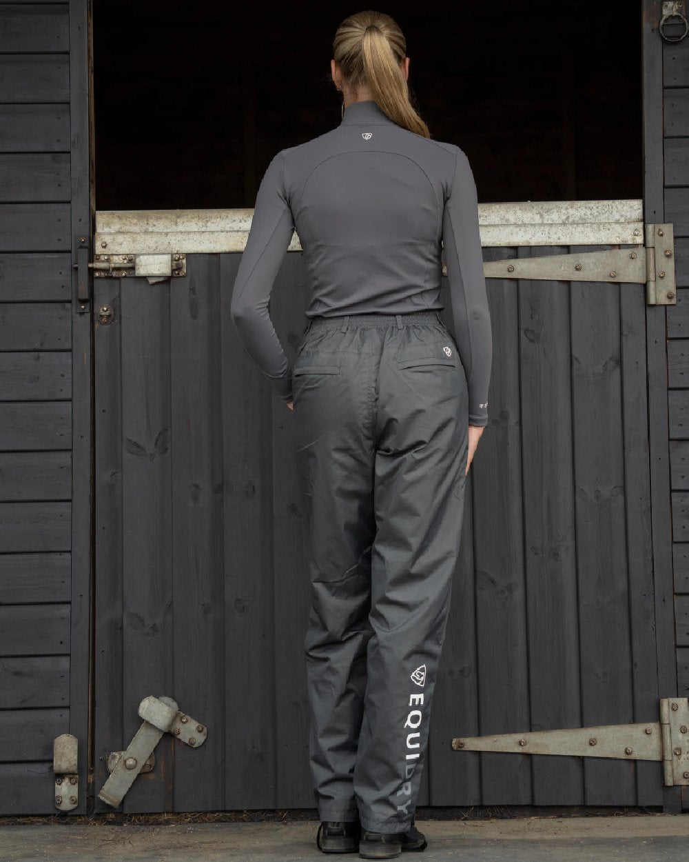 Charcoal Coloured Equidry Womens Waterproof Fleece Lined Trousers on outdoor background 