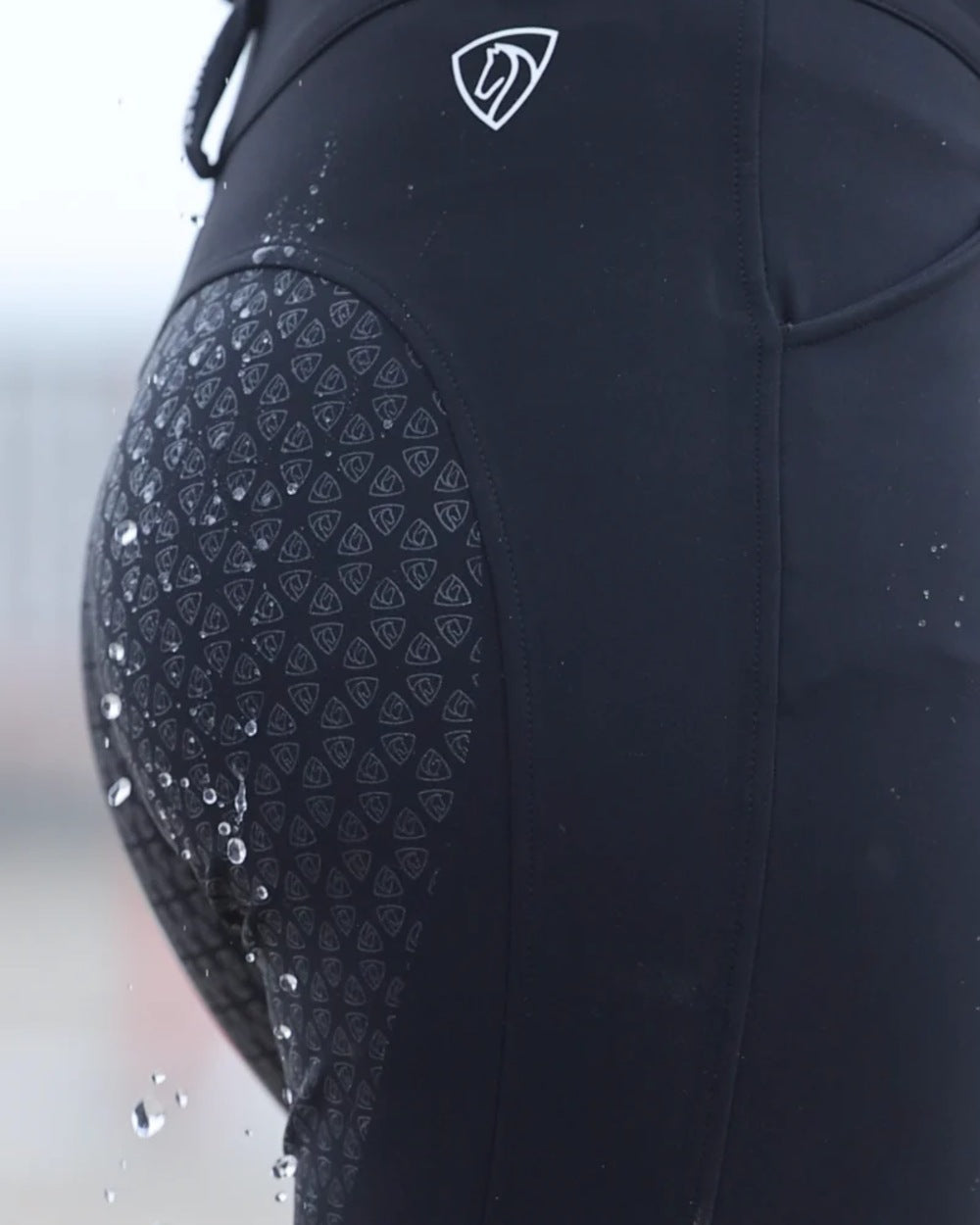 Black coloured Equidry Womens Waterproof Riding Breeches on outdoor background 