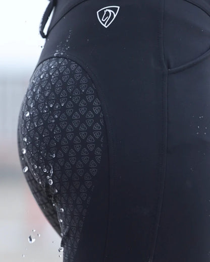 Black coloured Equidry Womens Waterproof Riding Breeches on outdoor background 