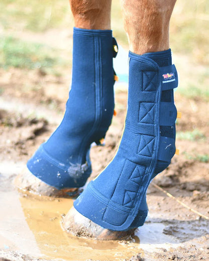 Navy coloured Equilibrium Equi-Chaps Close Contact Chaps on blurry background 