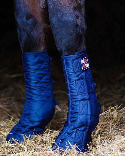 Blue coloured Equilibrium Equi-Chaps Stable Chaps on blurry background 