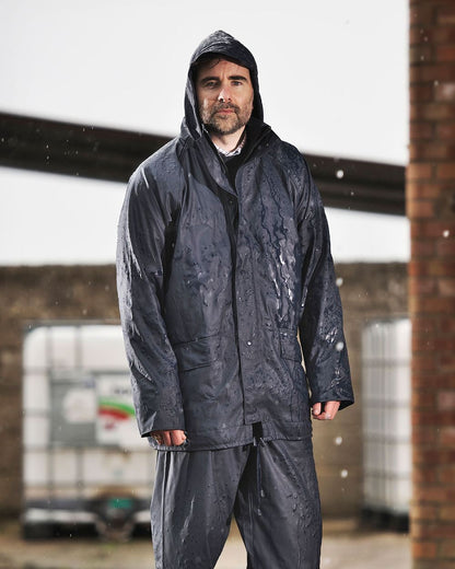 Navy coloured Fort Airflex Fortex Breathable Waterproof Jacket on blurry background 