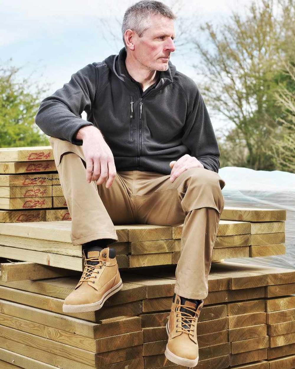 Tan coloured Fort Compton Safety Boots on blurry background 