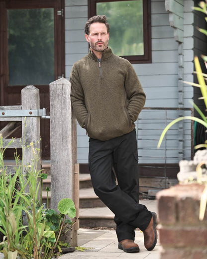 Green coloured Fort Easton Half Zip Fleece Pullover on blurry background 