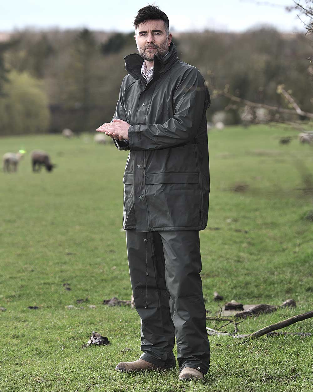 Green coloured Fort Fortex Flex Waterproof Trousers on green background 