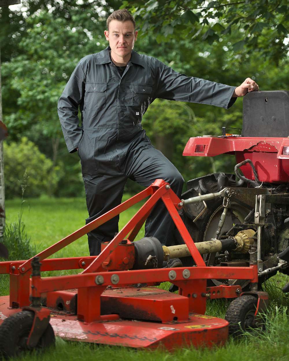 Farmer with mower wearing Fort Stud Front Boilersuit in Spruce 