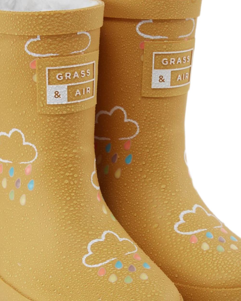 Ochre coloured Grass &amp; Air Childrens Colour-Changing Wellies on white background 