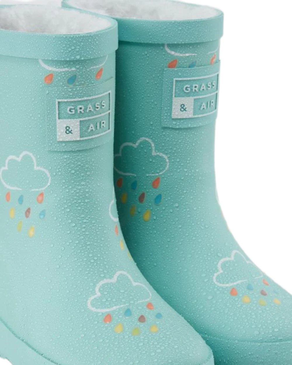 Pistachio coloured Grass &amp; Air Childrens Colour-Changing Wellies on white background 