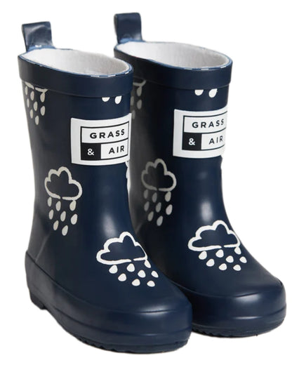 Navy coloured Grass &amp; Air Childrens Colour-Revealing Wellies on white table background 