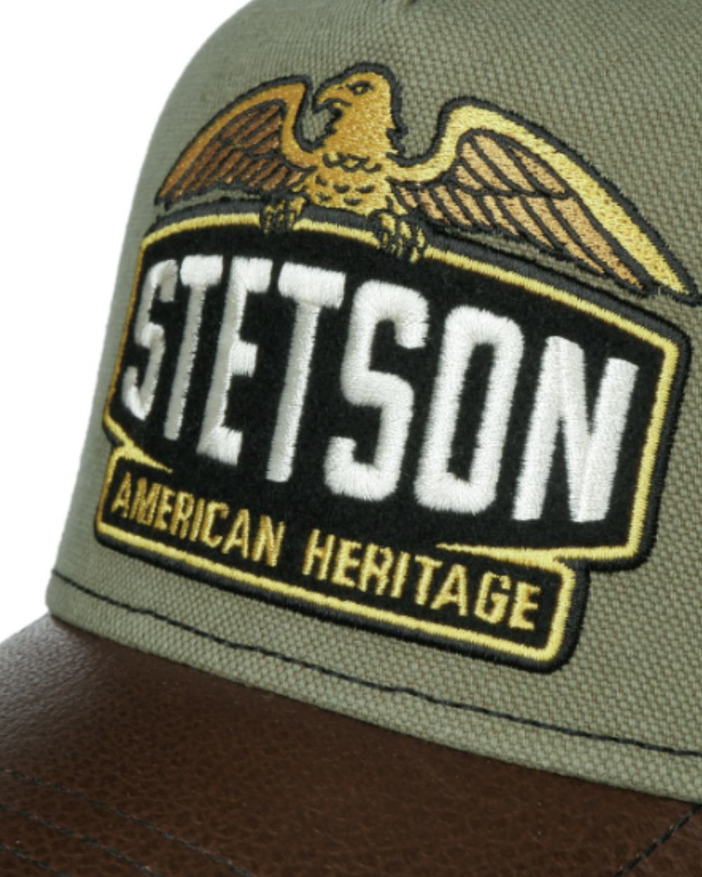 Green/Brown coloured Stetson Army Trucker Cap on White background 