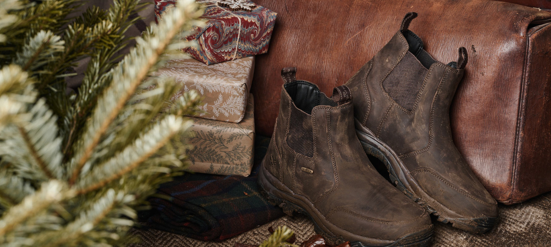 Brown Hoggs of Fife dealer boots on Christmas background