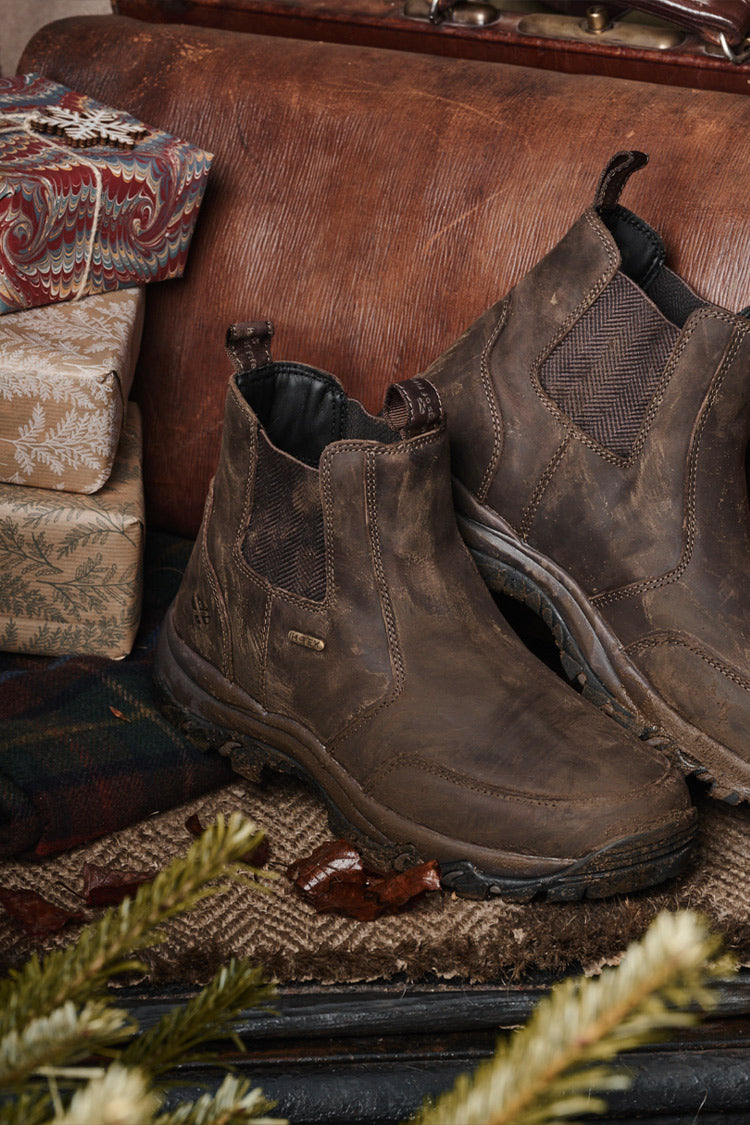 Brown Hoggs of Fife dealer boots on Christmas background