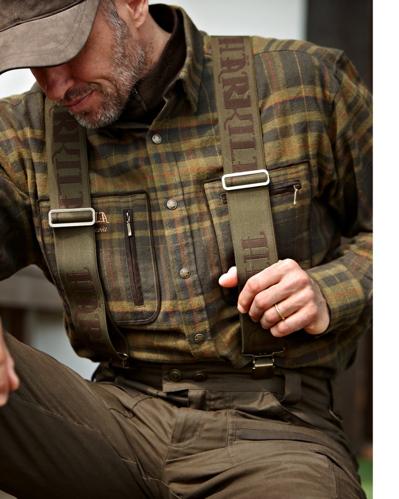 Man wearing Härkila braces with a country check shooting shirt and outdoor trousers