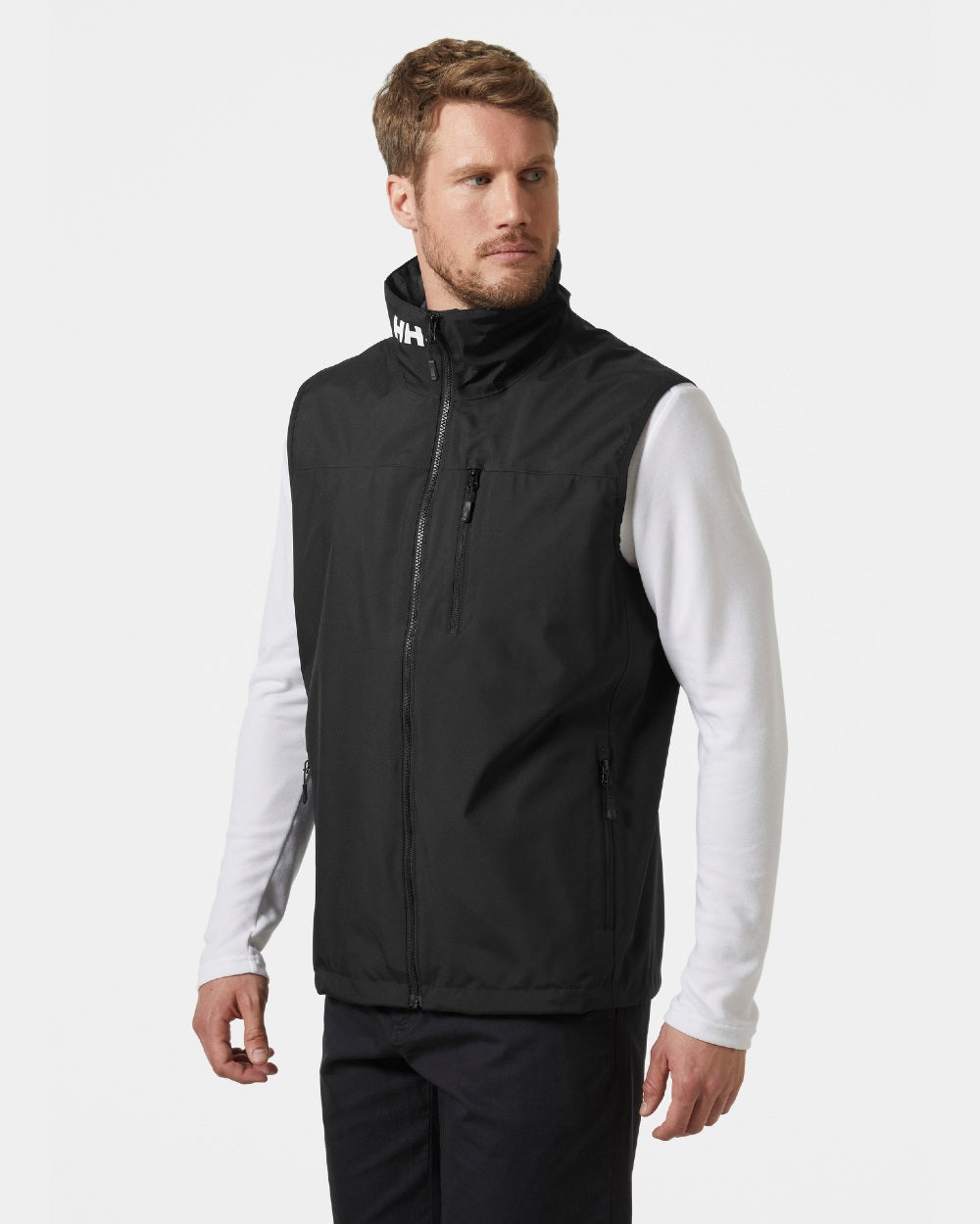 Black coloured Helly Hansen Mens Crew Sailing Vest 2.0 on grey background 