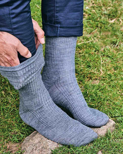 Grey coloured HJ Hall Extra Wide Soft Top Sock Sanitised Wool on grass background 