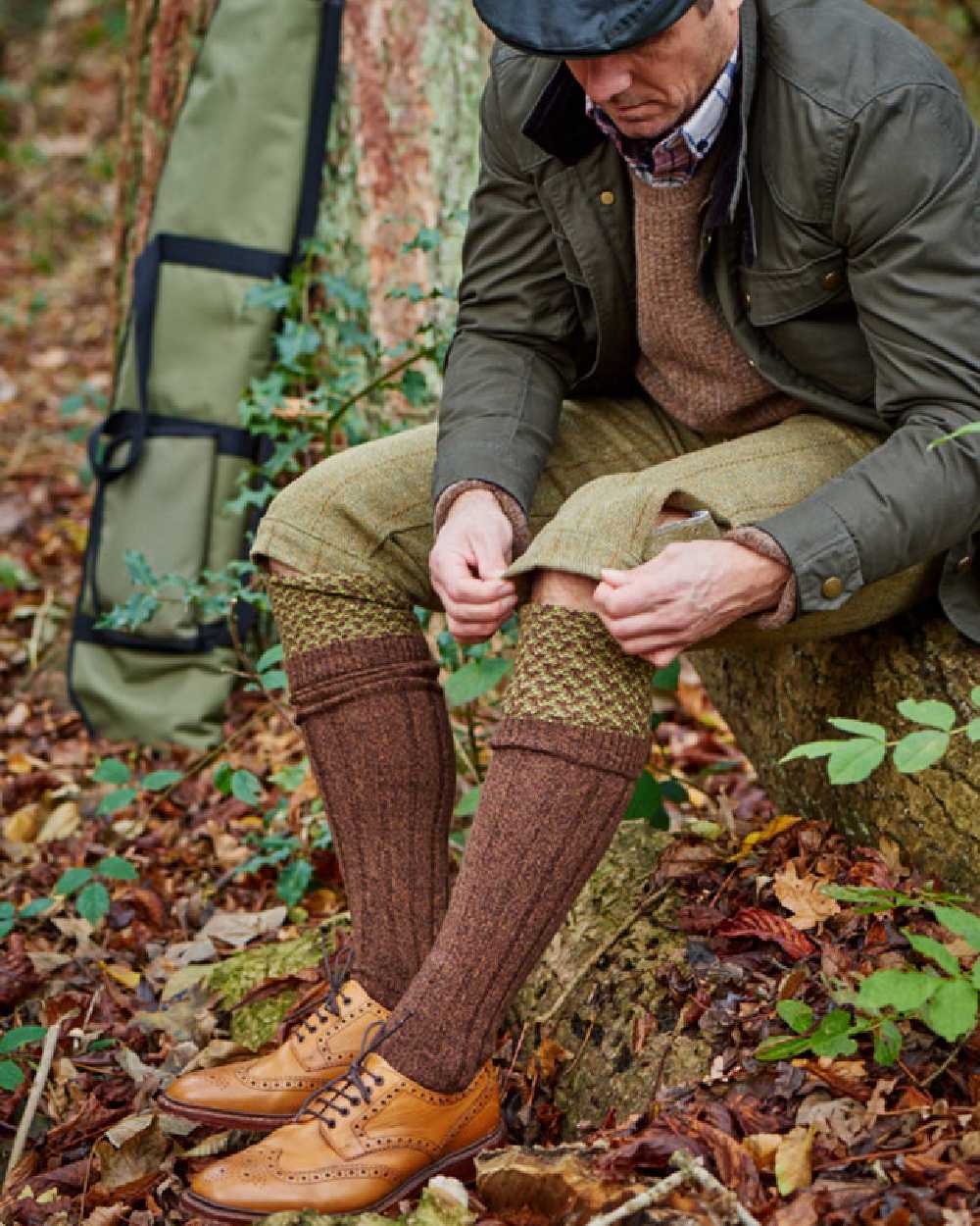 Conker Marl coloured HJ Hall Hatfield Shooting Sock Textured Top on field background 