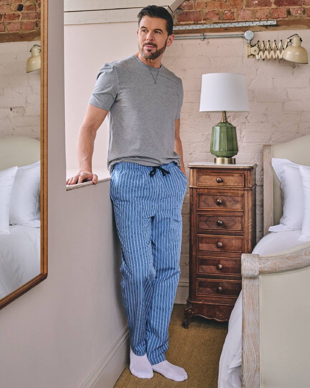 Grey Blue Coloured HJ Hall Mens Crew Neck T-Shirt And Long Pyjamas Set on indoor background 