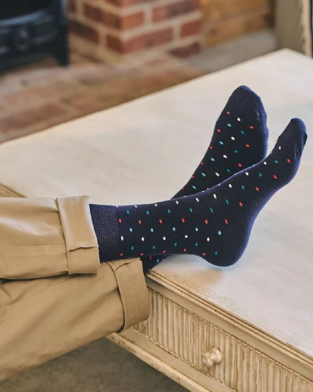 Navy coloured HJ Hall Mini Spot Comfort Top Socks on indoor background 