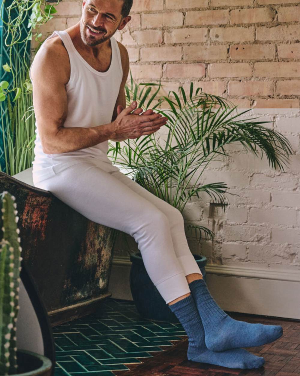 Denim coloured HJ Hall Original Cotton Soft Top Socks on indoor background 