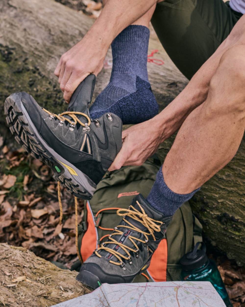 Navy coloured HJ Hall Technical Rambler All Season Comfort Cotton &amp; Wool Blend Socks on forest background 