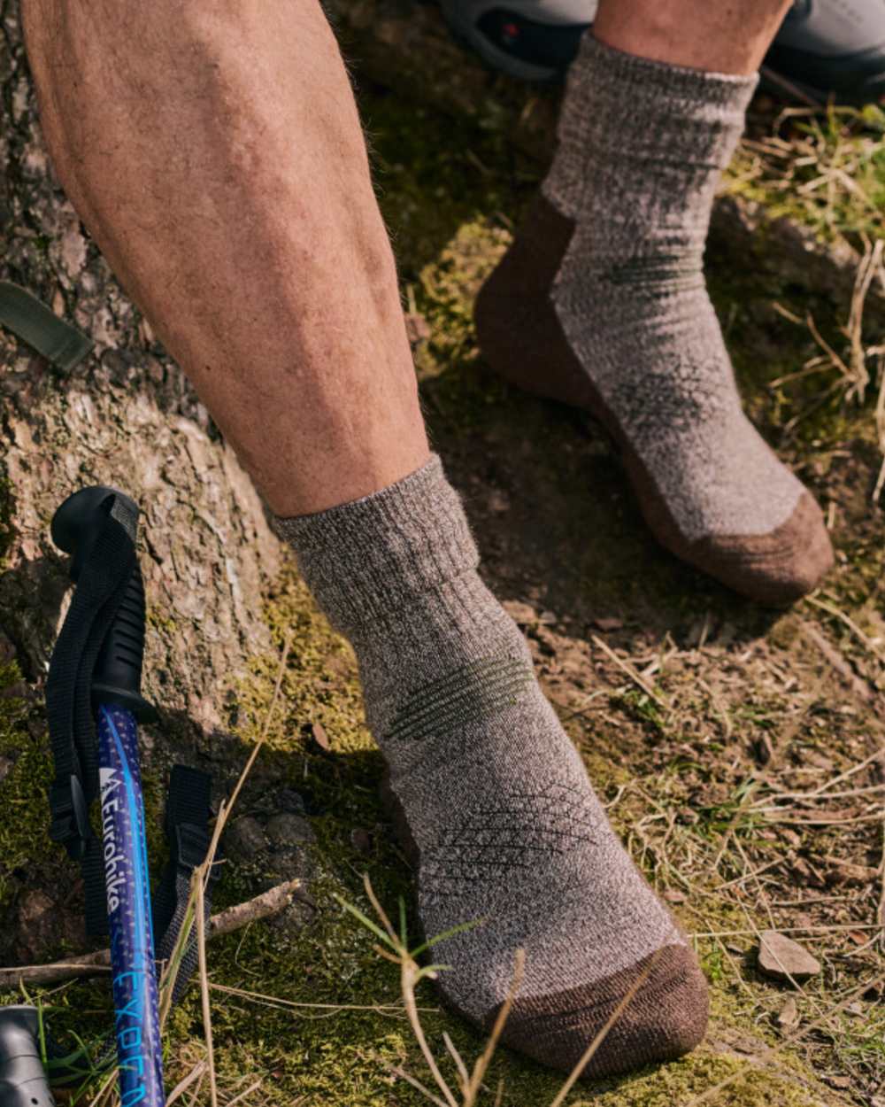 Brown coloured HJ Hall Technical Rambler Anti-Blister Dual Layer Wool Socks on forest background 