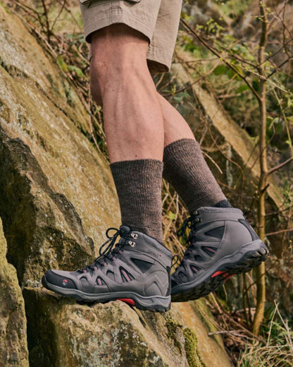 Brown coloured HJ Hall Technical Rambler Comfort Top Thermal Wool Socks on mountain background 