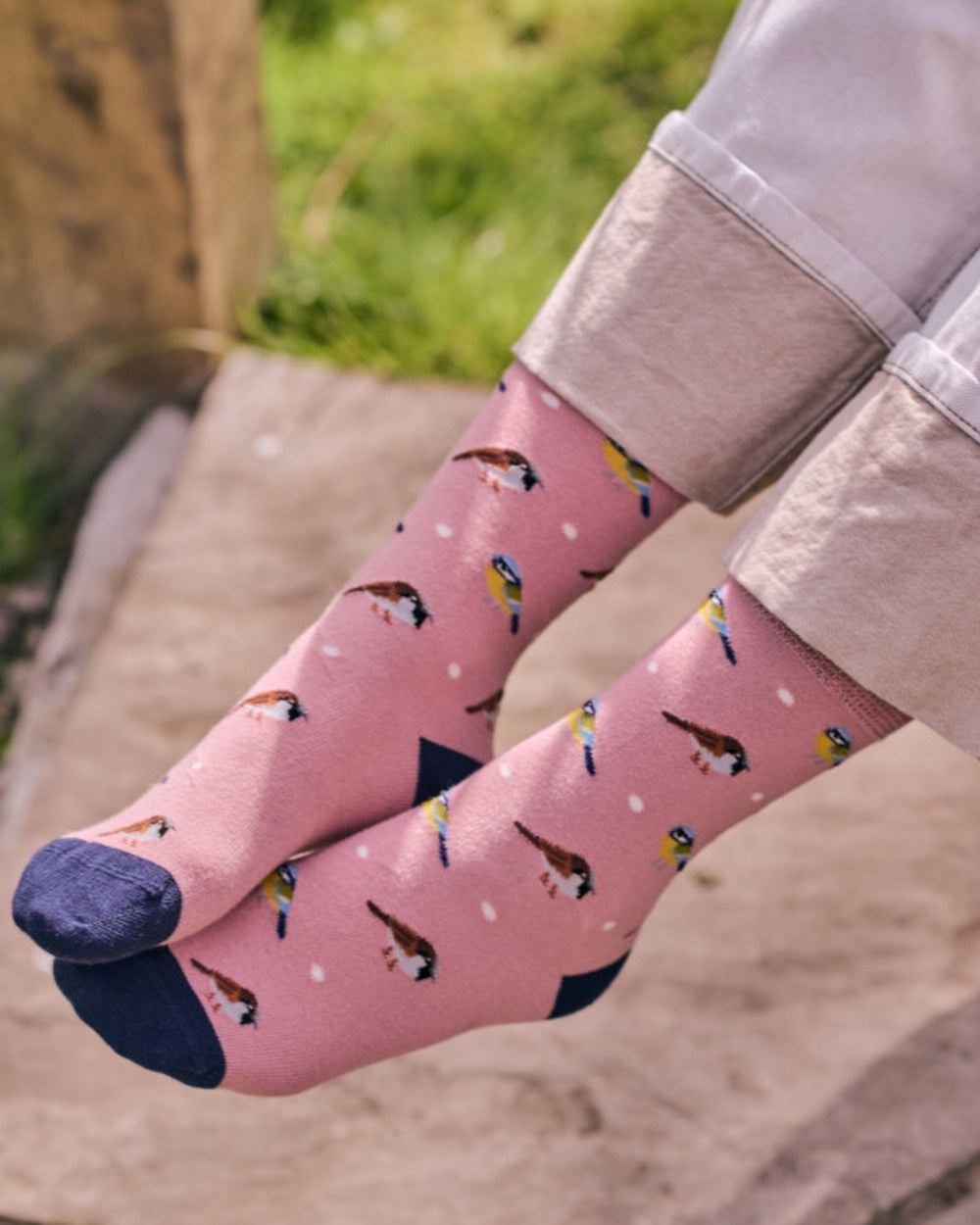 Pink coloured HJ Hall Womens Garden Birds Motif Cotton Comfort Top Socks on outdoor background 