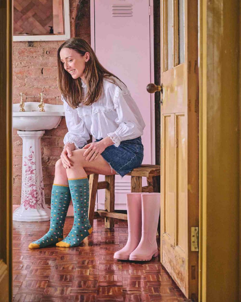 Light Teal coloured HJ Hall Womens Spot Welly Socks on house background 