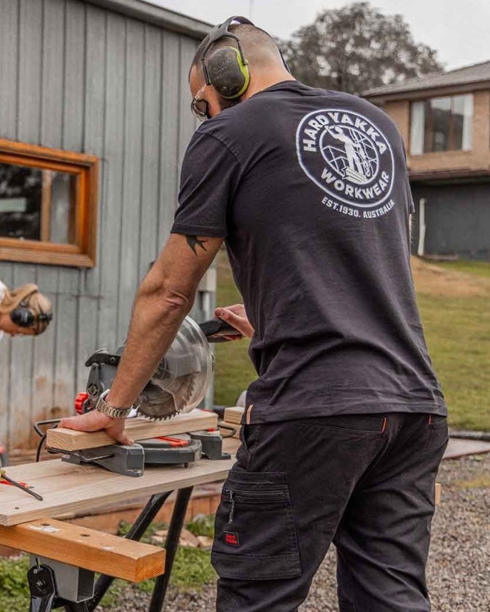 Black coloured Hard Yakka Heritage Icon T-Shirt on outdoor background 