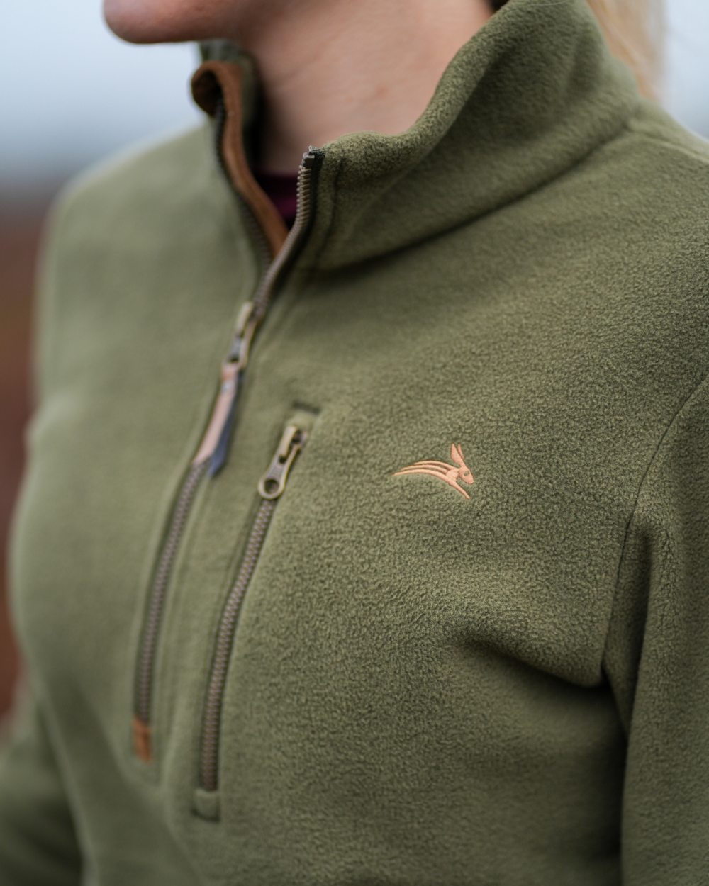 Olive coloured Harehill Womens Varden Fleece Quarter Zip Fleece on a moorland background 